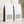 Two bulk 5 lb white coffee bags with black sides and pale green labels,  