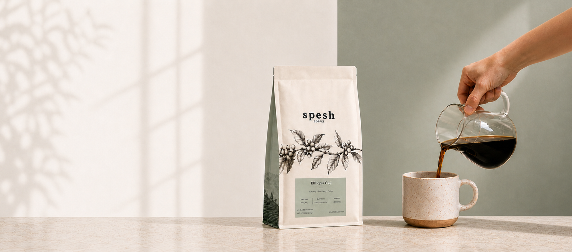 An Ethiopia Guji coffee bag beside a cup while fresh coffee is poured